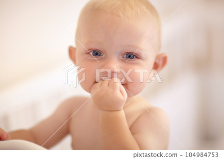 Happy, face and toddler standing in crib, bedroom or excited baby boy with hands on teething mouth in morning, nap or afternoon. Kid sitting in cot, awake and healthy bed routine for young child 104984753