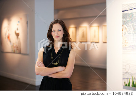 Pride, arms crossed and portrait of a woman at an art gallery for an exhibition. Creative, culture and a museum manager with management of paintings, collection and curator of pictures at a studio Pride, arms crossed and portrait of a woman at an art gallery for an exhibition. Creative, culture and a museum manager with management of paintings, collection and curator of pictures at a studio 104984988