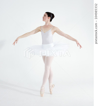 Dance, ballet and performance with woman in studio for balance, elegant and creative. Artist, theatre and training with ballerina dancing ion white background for competition, freedom and commitment Dance, ballet and performance with woman in studio for balance, elegant and creative. Artist, theatre and training with ballerina dancing ion white background for competition, freedom and commitment 104985332