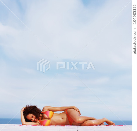 Relax, smile and bikini with black woman at beach for sunbathing, tropical and peace on Brazil vacation. Summer break, sun and blue sky with girl on deck of resort for travel destination and mockup Relax, smile and bikini with black woman at beach for sunbathing, tropical and peace on Brazil vacation. Summer break, sun and blue sky with girl on deck of resort for travel destination and mockup 104985333