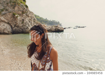 Travel, ocean or happy woman tourist on holiday, vacation or weekend trip for a fun adventure in Italy. Summer, view or funny girl laughing with freedom or smile abroad in nature or sea to relax Travel, ocean or happy woman tourist on holiday, vacation or weekend trip for a fun adventure in Italy. Summer, view or funny girl laughing with freedom or smile abroad in nature or sea to relax 104985458