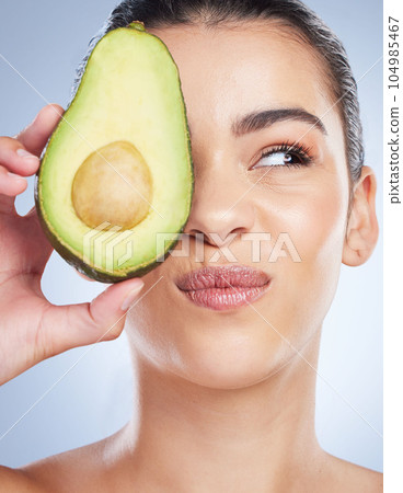 Avocado, skincare and face of woman in studio with doubt of natural detox, wellness or omega 3 treatment on white background. Fruit, diet or lady model unsure of anti aging or vitamin c facial beauty Avocado, skincare and face of woman in studio with doubt of natural detox, wellness or omega 3 treatment on white background. Fruit, diet or lady model unsure of anti aging or vitamin c facial beauty 104985467
