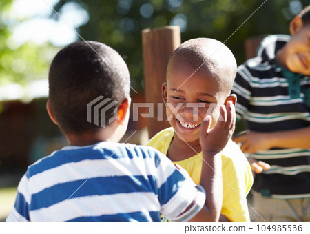 Playground, happy kids or friends in a park playing together outdoors in nature on preschool break. Happiness, diversity or fun children with a smile laughing, smiling or bonding in kindergarten 104985536