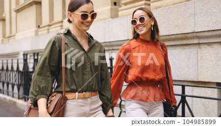 Business women walking down the tree Relax, smile and happiness with female walking in urban town for break, conversation and social 104985899