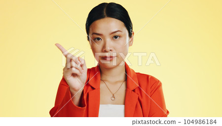 Face, warning and Asian woman serious, finger and stop against a studio background. Portrait, Japanese female and lady with hand gesture for rejection, unhappy girl and frustrated with disagreement Face, warning and Asian woman serious, finger and stop against a studio background. Portrait, Japanese female and lady with hand gesture for rejection, unhappy girl and frustrated with disagreement 104986184