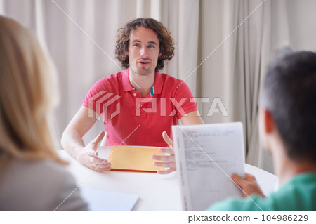 Man, interview and meeting for a job, recruitment and hiring opportunity for a worker, employee and resume review. People, business and internship application, documents or conversation with hr 104986229