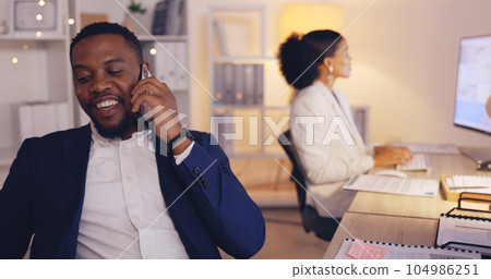 Laugh, night and phone call with black man in office for consulting, networking and communication. Discussion, connection and hello with male in agency for commitment, positive and overtime Laugh, night and phone call with black man in office for consulting, networking and communication. Discussion, connection and hello with male in agency for commitment, positive and overtime 104986251