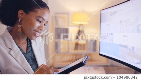 Reading, business and tablet with black woman in office for website, branding and digital marketing. Review, night and corporate with female employee at computer for planning, proposal and commitment 104986342