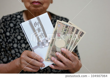 Elderly woman with a gift Elderly woman with a gift 104987064
