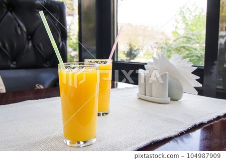 Two glasses of orange juice. Healthy drink concept. 104987909