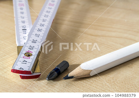 Measuring tape meter and pensil. Construction tools. Measuring tape meter and pensil. Construction tools. 104988379