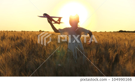 little child girl daughter runs through wheat field with toy plane her hand sunset, happy family dream fly, child dreams becoming astronaut pilot pilot sky, go everywhere, cheerful child with toy little child girl daughter runs through wheat field with toy plane her hand sunset, happy family dream fly, child dreams becoming astronaut pilot pilot sky, go everywhere, cheerful child with toy 104990166