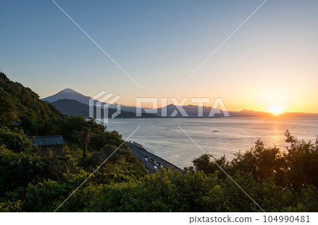 Mount Fuji and street by bay from Satta Toge pass at sunrise, Shimizu 104990481