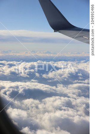 Sky and clouds seen from an airplane 104991466