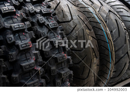 Tyre shop for sale in the store. Sale of car tires. 104992003