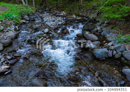 Fresh mountain stream 104994351