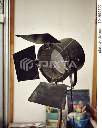 Antique fresnel studio on tripod . space for text Antique fresnel studio on tripod . space for text 104994502