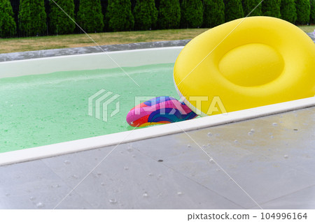 Raindrops fall on the surface of the pool. Raindrops fall on the surface of the pool. 104996164