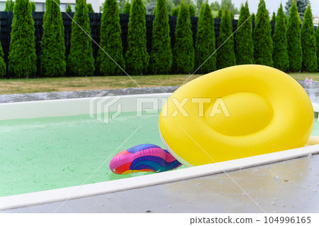 Raindrops fall on the surface of the pool. Raindrops fall on the surface of the pool. 104996165