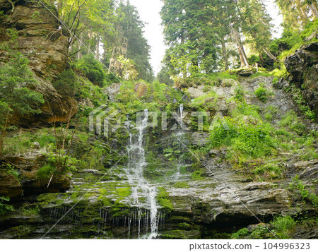 Waterfalls forest virgin nature Vysoky vodopad, aerial drone stream way through stones fairytale summer landscape Jeseniky, beauty untouched primeval forest, crystal clear water wilderness Europe 104996323