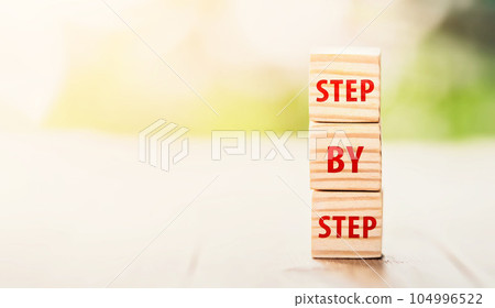 he word step by step on wooden cubes. Achievement or progress in business career. Business growth, career growth or goal concept. he word step by step on wooden cubes. Achievement or progress in business career. Business growth, career growth or goal concept. 104996522