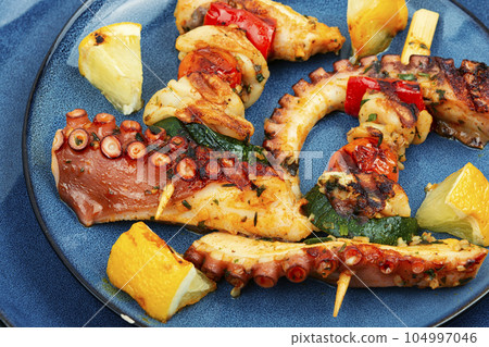 Octopus skewers, sea delicacy. 104997046