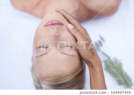 Relax, luxury facial and massage, woman in salon for health, wellness and beauty treatment with eyes closed. Spa, professional skin care therapist hand on face of girl and natural cosmetic therapy. 104997449