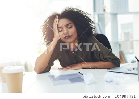Stress, burnout and tired business woman in office with fatigue, overworked and exhausted from working. Sleeping, anxiety and African female worker lazy for deadline, workload and pressure at desk 104997451