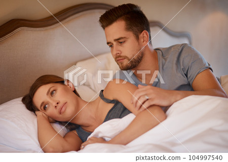 Argument, angry and couple fight in bed for divorce or breakup in their modern house. Toxic problem, mad and upset woman and man laying with conflict together in the bedroom of their apartment. Argument, angry and couple fight in bed for divorce or breakup in their modern house. Toxic problem, mad and upset woman and man laying with conflict together in the bedroom of their apartment. 104997540