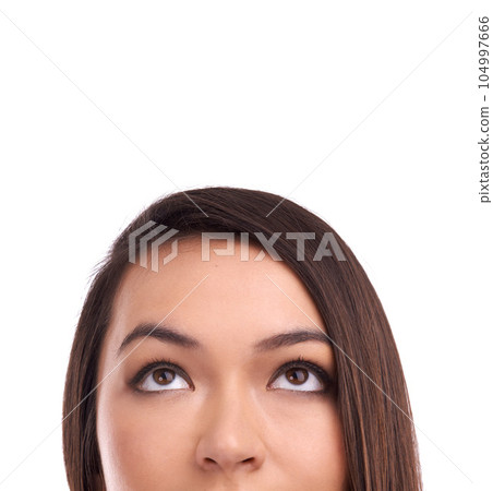 Half face of a woman looking at mockup space in a studio for product placement or marketing. Beauty, young and female model a with empty mock up for advertising isolated by a white background. 104997666