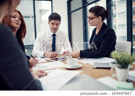 Discussion, brainstorming and business people in meeting in the office for planning with research. Collaboration, teamwork and group of designers working on strategy or project in workplace boardroom 104997667