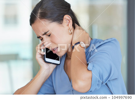 Neck pain, smartphone and business woman on telehealth phone call for advice on fatigue, burnout and healthcare in office workplace. Sad, muscle pain or tired corporate employee talking on cellphone 104997690