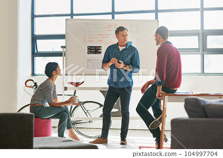 Presentation, coaching and business man startup on whiteboard strategy, planning and workshop. Teamwork, business growth and mentor, manager or boss speaking to employees of mission, ideas or goals Presentation, coaching and business man startup on whiteboard strategy, planning and workshop. Teamwork, business growth and mentor, manager or boss speaking to employees of mission, ideas or goals 104997704