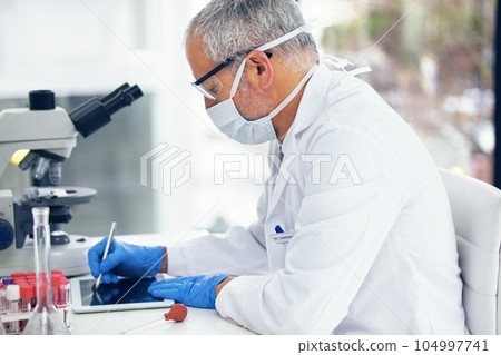 Science, tablet and scientist writing results of a vaccine in after medical exam in a lab or laboratory. Medicine, research and healthcare man or chemistry professional with solution for covid 104997741