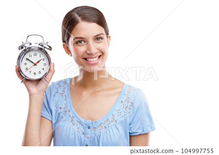 Portrait, clock and hand with a model woman in studio isolated on a white background showing an alarm. Time, vintage reminder with a female holding an alarm clock or timer on a blank space 104997755