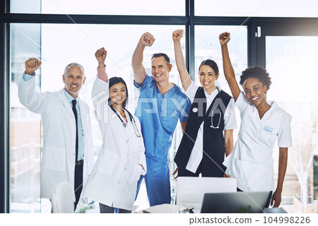 Doctor, team and celebration in healthcare for winning, success or achievement together at the hospital. Group portrait of happy doctors in joy for medical win, victory or teamwork at the clinic Doctor, team and celebration in healthcare for winning, success or achievement together at the hospital. Group portrait of happy doctors in joy for medical win, victory or teamwork at the clinic 104998226