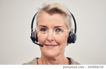 Shes mastered the sales game all these years. Portrait of a senior businesswoman wearing a headset while working in an office. Shes mastered the sales game all these years. Portrait of a senior businesswoman wearing a headset while working in an office. 104998230