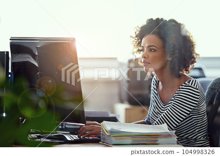 Computer, thinking and business woman in office for research, creative and planning. Focus, professional and technology with female employee on digital agency for startup, email and website designer 104998326
