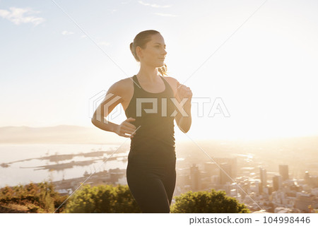 Runner, fitness and woman with sports, balance and performance with endurance, training and wellness. Female person, athlete or lady outdoor, running and workout with target, health and exercise goal 104998446