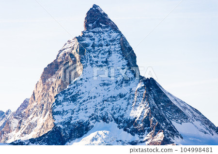 Snowy mountain Matterhorn during the day in winter. Zermatt, swiss alps 104998481