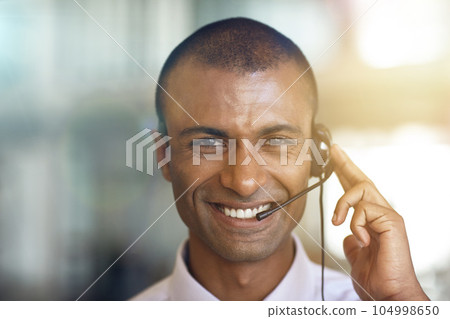 Call center, portrait and happy man in virtual communication, business support and e commerce helping. Face of IT agent, advisor or african person smile for telecom, customer service or client advice Call center, portrait and happy man in virtual communication, business support and e commerce helping. Face of IT agent, advisor or african person smile for telecom, customer service or client advice 104998650