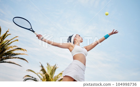 I always aim for the sky. Low angle shot of young tennis player standing alone on the court and serving the ball during practice. I always aim for the sky. Low angle shot of young tennis player standing alone on the court and serving the ball during practice. 104998736
