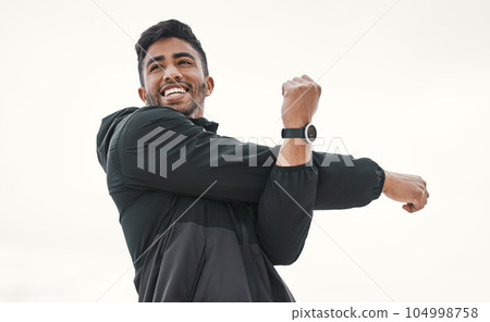 Good days start with a workout. a young man stretching on the beach. Good days start with a workout. a young man stretching on the beach. 104998758