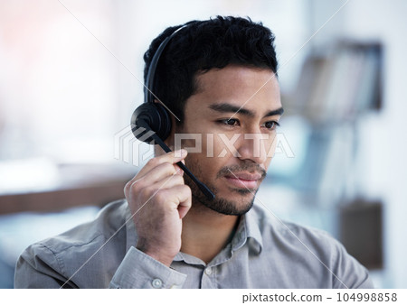 Call center, listening and business man telemarketing, customer service and support in office. Crm, contact us and Asian male sales agent, consultant and professional working, consulting or help desk 104998858