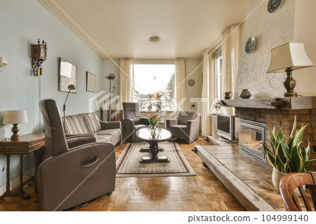 a living room with couches, chairs and a fire place in the middle part of the room is empty a living room with couches, chairs and a fire place in the middle part of the room is empty 104999140