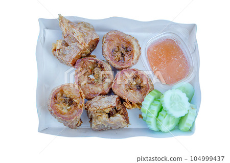 Top view of Deep Fried Crab Meat Rolls on white isolated, focus selective 104999437