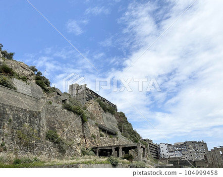 Gunkanjima against the blue sky 104999458