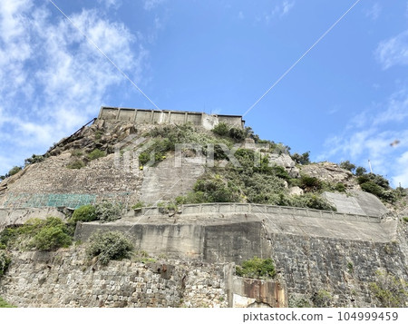 Gunkanjima against the blue sky 104999459