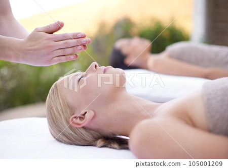 Reiki, relax and face of woman at spa for health, wellness and peace, luxury skincare treatment. Holistic massage, beauty salon and professional skin care, facial healing for girl in cosmetic therapy 105001209