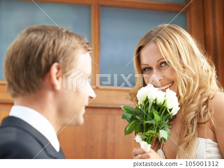 Couple, flowers and woman with smile in valentines day, relationship or celebration for date. Happy female holding white roses, bouquet or gift from boyfriend for anniversary or special month of love Couple, flowers and woman with smile in valentines day, relationship or celebration for date. Happy female holding white roses, bouquet or gift from boyfriend for anniversary or special month of love 105001312